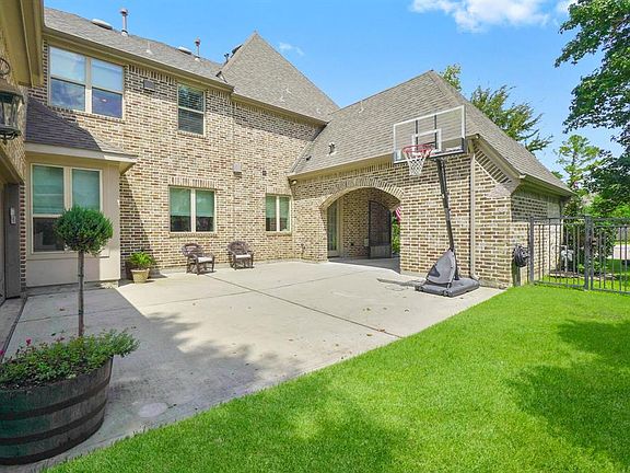 Driveway with plenty of parking and room to play. To the right is storage!