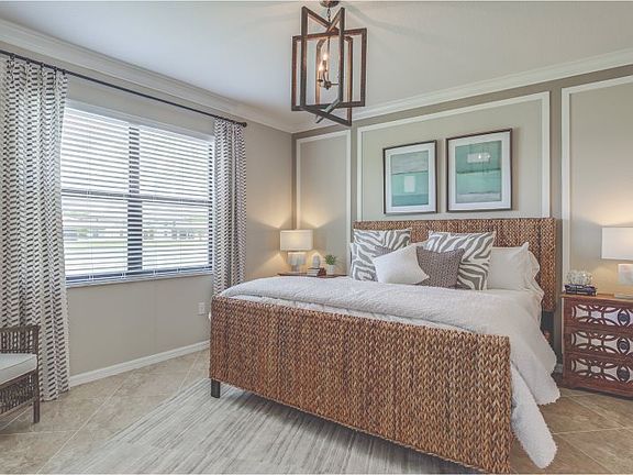 The owner s suite is tucked into the back corner of the home for maximum privacy, featuring a serene