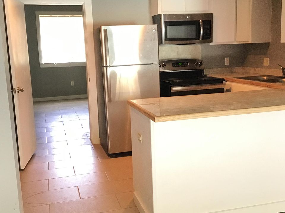 Open kitchen with bar + stainless steel appliances