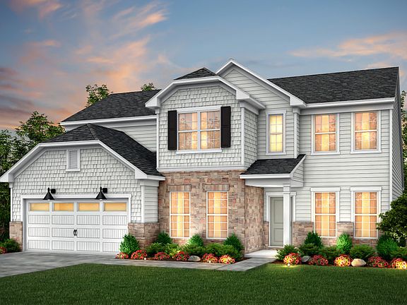 Vanderbilt Exterior 6 features siding, shakes, stone, covered front door and 2 car garage