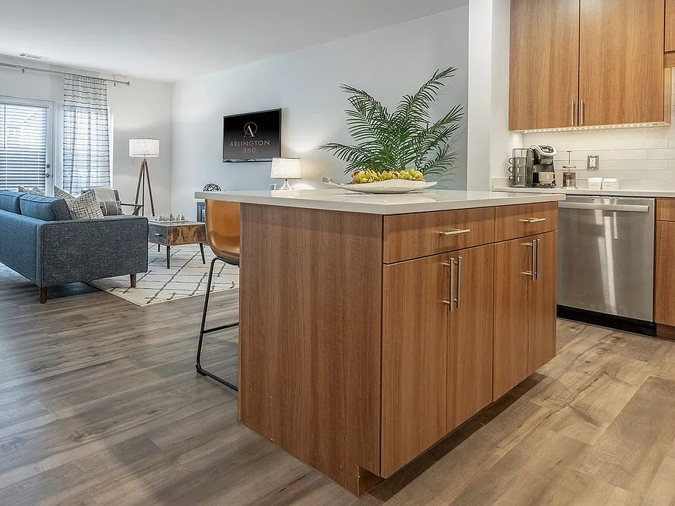A kitchen island faces the living room, so cooking happens in the same room.
