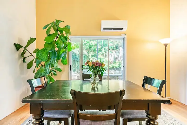 Expandable dining room table can accommodate up to 8 people for a group dinner