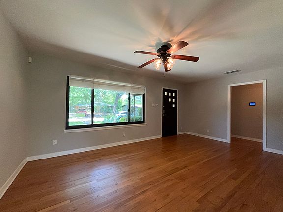 Living area, front entry. Doorway to right to bedrooms