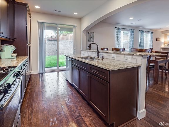 Kitchen opens to breakfast area and living room