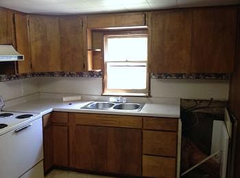 Kitchen view with space for a brand new dishwasher.