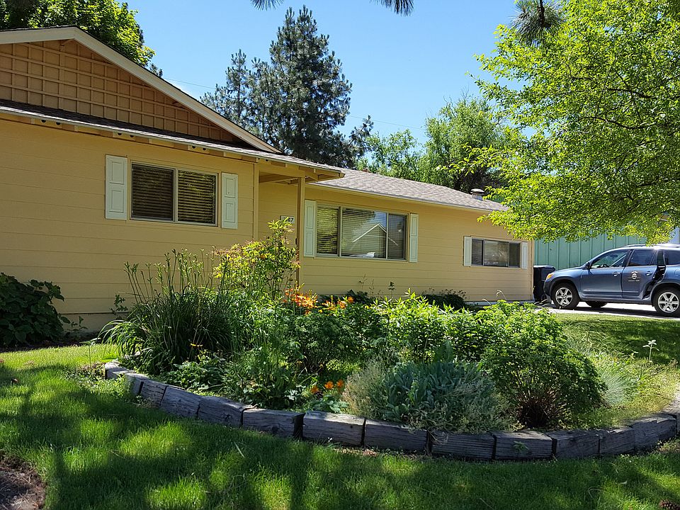 House front with garden.