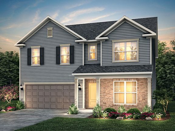 Hampton Exterior LC2M features hardie siding, brick, covered porch and 2 car garage