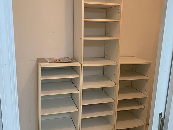 Organize your belongings in this California closet master bedroom