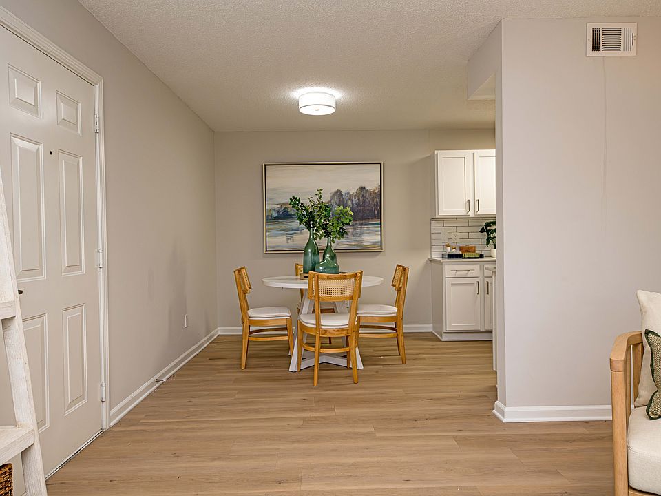Dining room with hardwood-style flooring