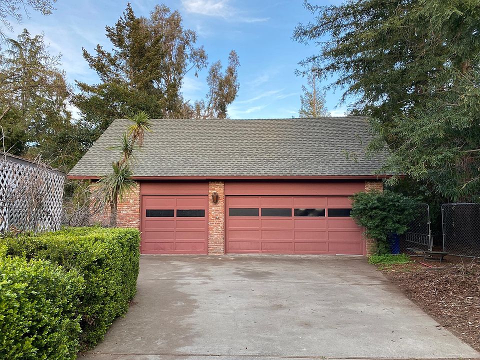 2-car garage plus RV space and carport on side