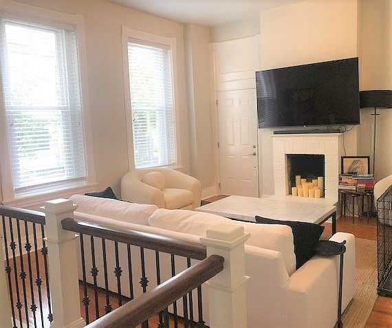 Living Room 
High Ceilings & windows, Hardwood flooring, decorative mantle