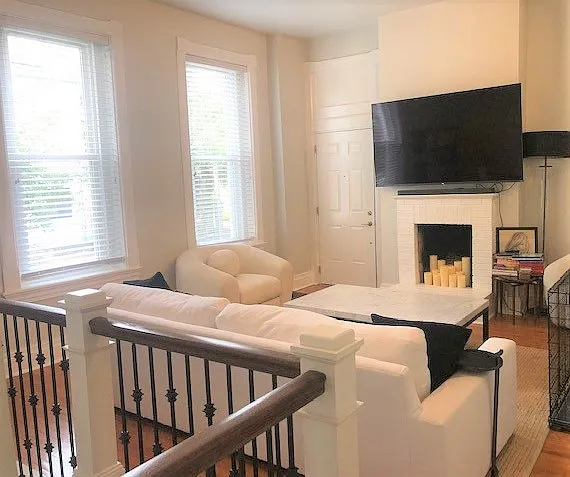 Living Room 
High Ceilings & windows, Hardwood flooring, decorative mantle