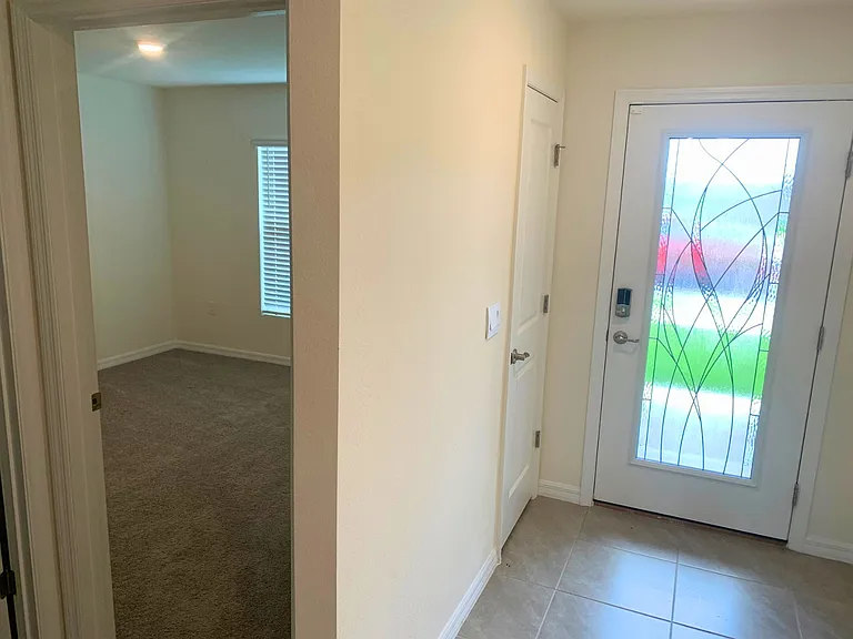 Front Door, Coat Closet, and First Bedroom