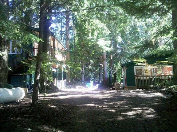 Family compound with spacious yard. House is on the right. Mother in law and garage on the left.