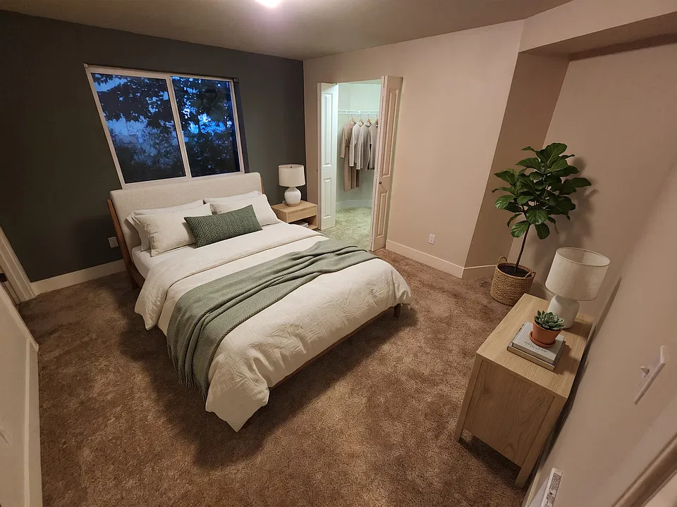 Room for a queen bed and nightstands with floor to spare, plus a walk-in closet you can actually walk into.