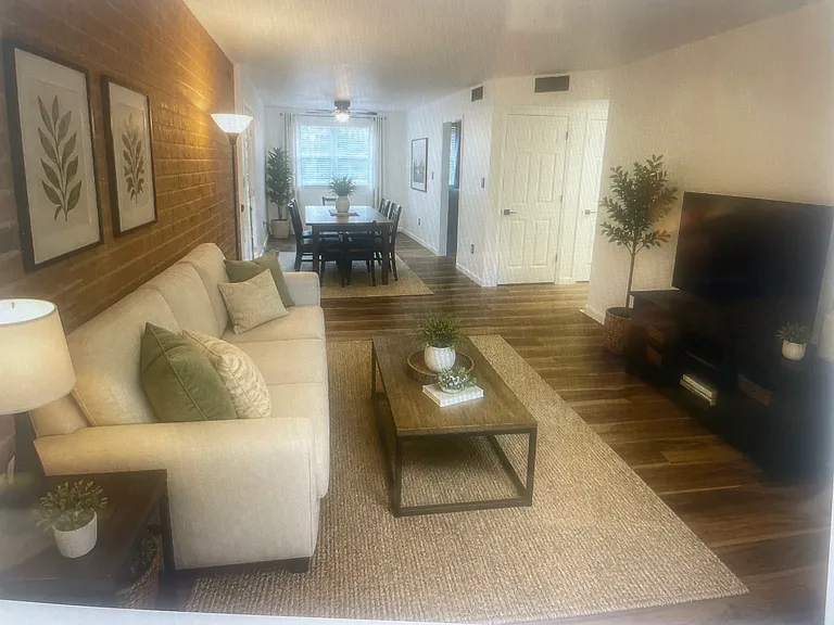 Virtually staged living room and dining room.