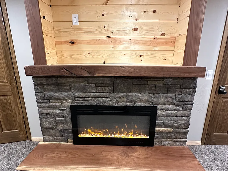 Basement Fireplace. Space for a TV above.