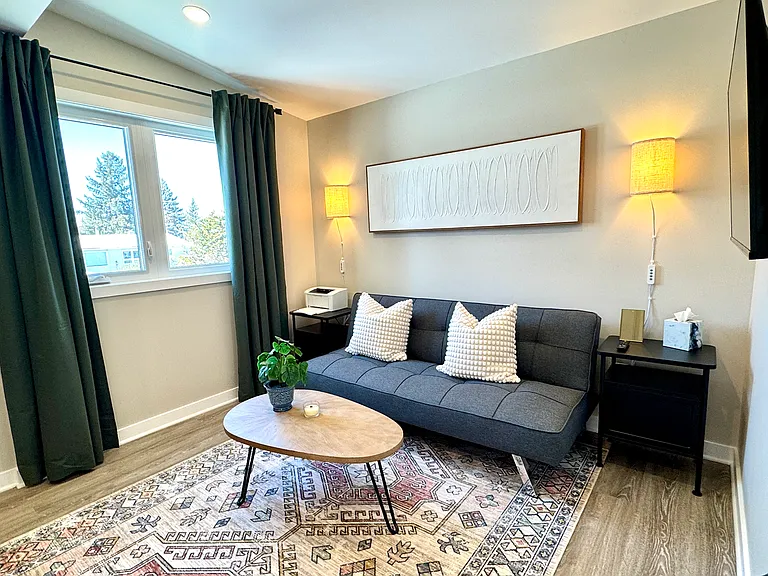 Dedicated sunlit den and workspace for remote work in this Ottawa suite.