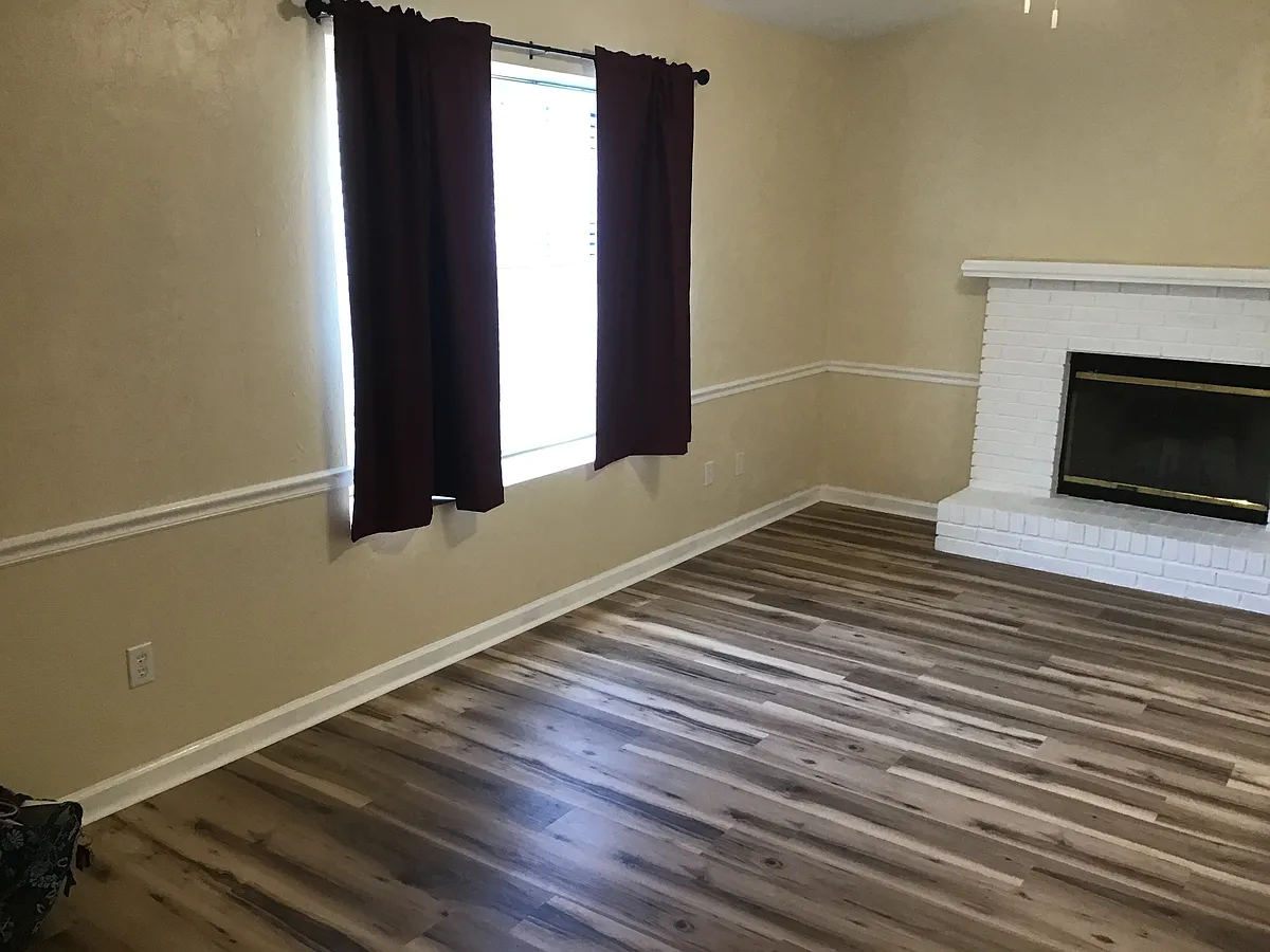 Livingroom include insulated with new blind and a fireplace. - 2009 Pecan Ct