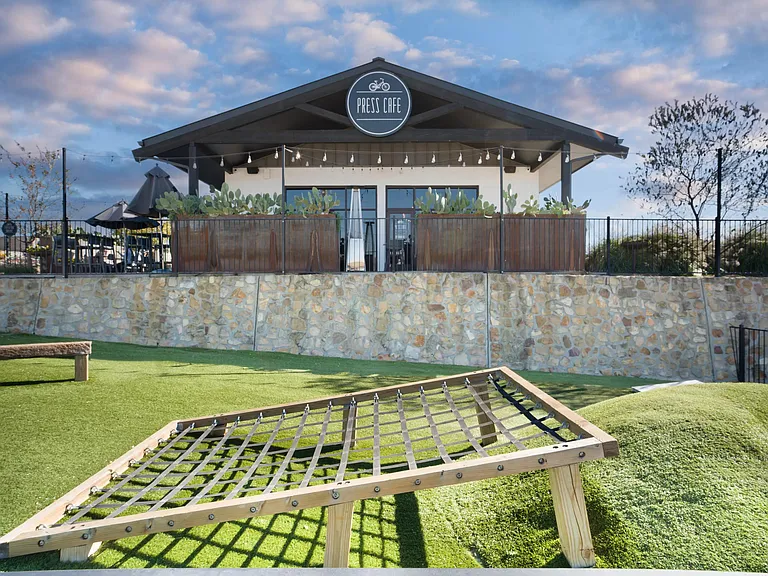 Press Cafe at The District offers a relaxed outdoor setting for coffee or bites, just minutes from Modera Walsh Heights.