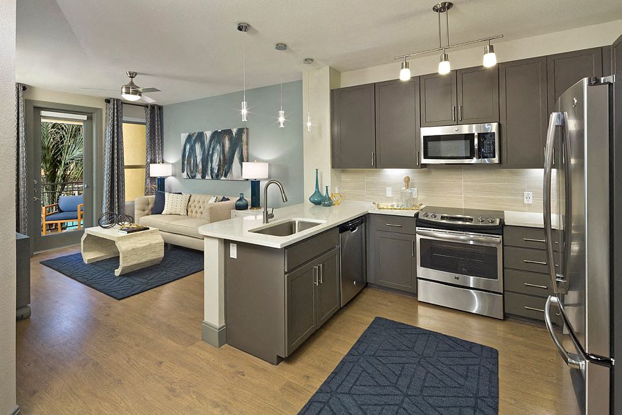 Luxury vinyl plank flooring in entry, kitchen, living and dining rooms