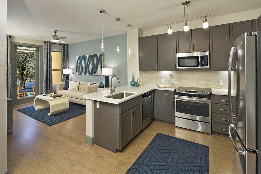 Luxury vinyl plank flooring in entry, kitchen, living and dining rooms