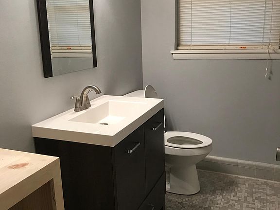 Hall bath New cabinet, fixtures, mirror,updates