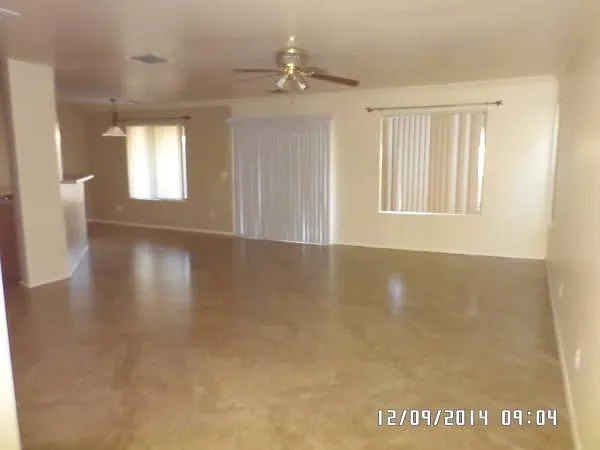 Downstairs Living Room area. Shows partial Dining area.