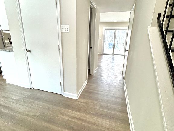 front entryway hall view leading into living room