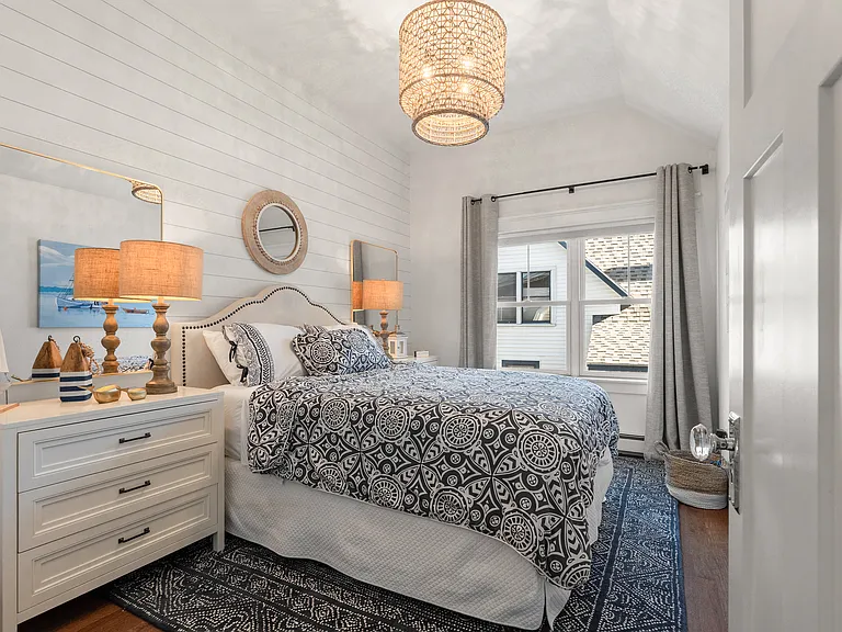 Gorgeous queen guest room with his and hers dressers, brand new Serena and Lily rug. Serena and lily bedding.