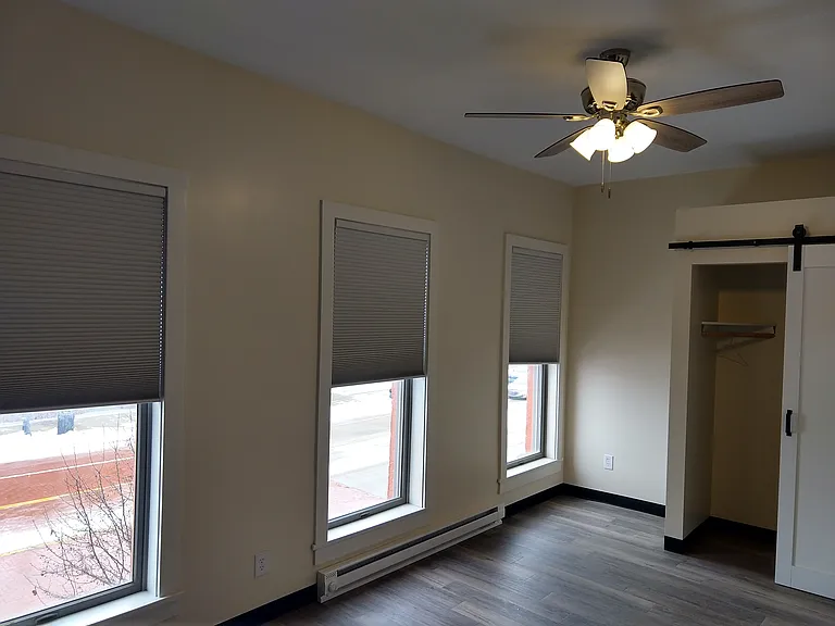 Here is a great spot to fit a desk in the corner looking over the streets.