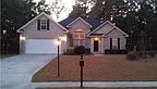 REDUCED..New construction, shows like a model home. All brick, hardwoods