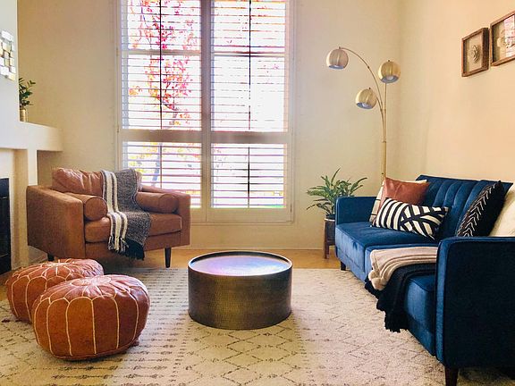 Large Living Room with High Ceilings, Hardwood Floors and Wood Shutters