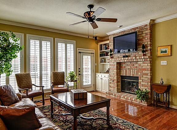 Spacious Great Room! See-thru FP, Built-ins, Wall of Windows & Patio Access.