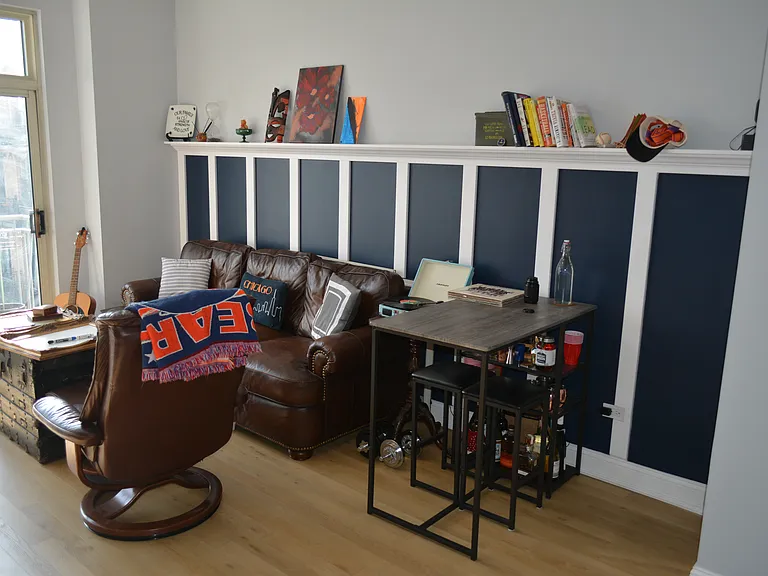 Custom board and batten wall gives you over 15 feet of shelving space and a one-of-a-kind storage solution