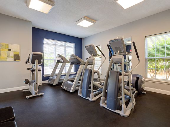 24/7 fitness center with two treadmills, two elliptical machines and stationary bicycle.