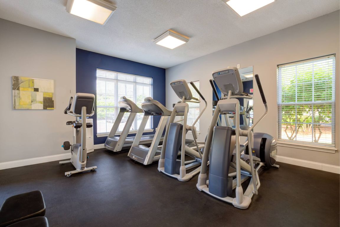 24/7 fitness center with two treadmills, two elliptical machines and stationary bicycle.