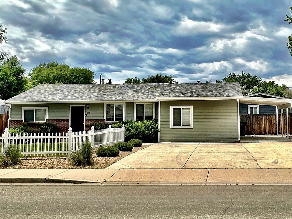 Fresh paint, new roof, covered parking and extra wide driveway with quaint picket fence