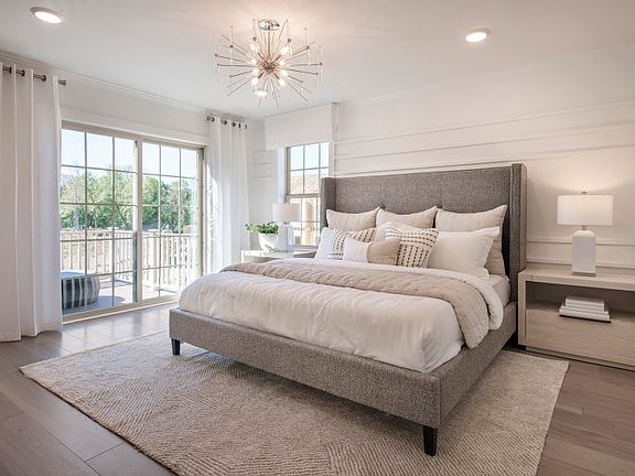 Owner s suite with large windows for natural light