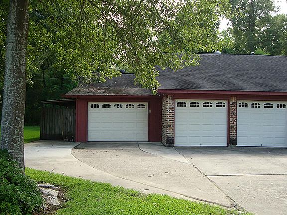 LOVE THE GARAGE - 2 CAR ATTACHED AND SELLER ADDED A THIRD CAR AND STILL ANOTHER PARKING SPOT FOR A B