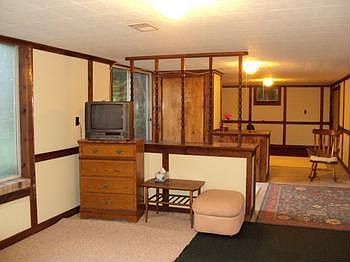 PARTIALLY FINISHED WALK OUT BASEMENT WITH A FIREPLACE.