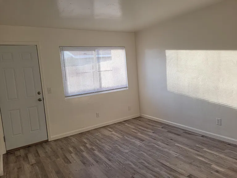 Bedroom 2 with door to backyard.