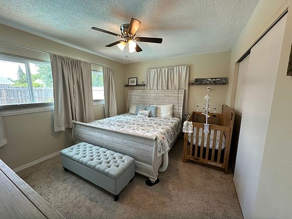 Spacious master bedroom with lots of natural sunlight, faces the pool and backyard area