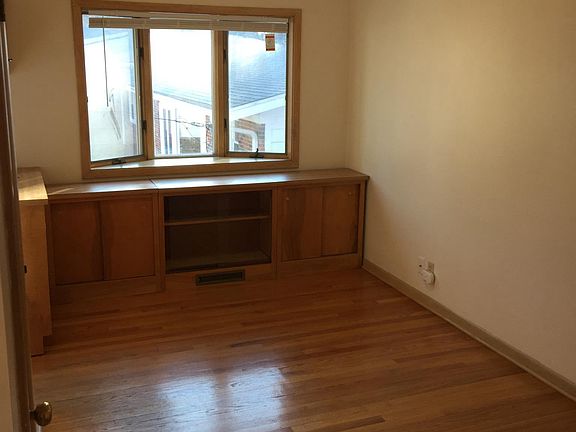 Dining room off of the kitchen, bay window & storage cabinet
