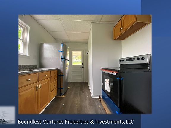 Kitchen includes new microwave, refrigerator, stove-oven, and dishwasher.