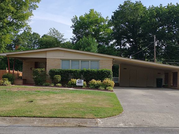 Front of house with 2 car carport