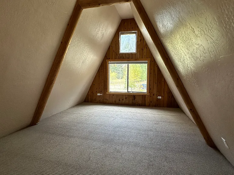Loft area accessed via spiral staircase.