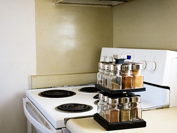 Kitchen with stove and fridge (not pictured)