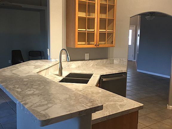 Kitchen area, newly installed granite countertops. Great dining area.