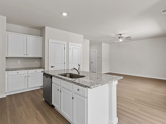 The open layout has the kitchen being open to the family room.